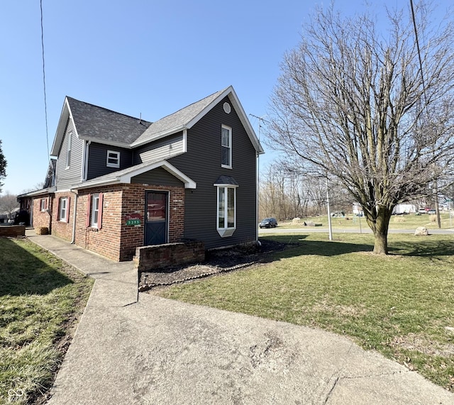 5395 W State Road 38, New Castle, IN 47362 - view of front of property featuring brick siding, a shingled roof, and a front lawn