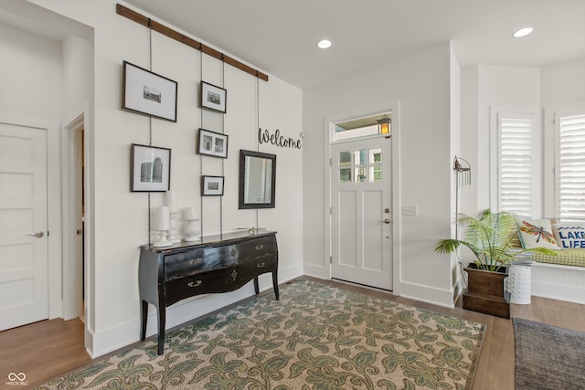 entryway with recessed lighting, wood finished floors, and baseboards