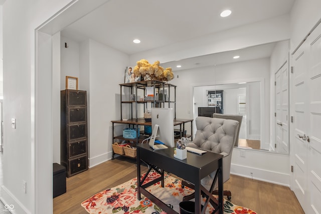 office area with recessed lighting, baseboards, and wood finished floors