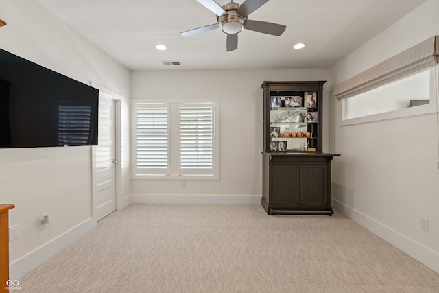 carpeted empty room with visible vents, recessed lighting, baseboards, and ceiling fan