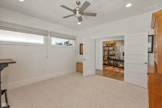 interior space with recessed lighting, baseboards, visible vents, and carpet floors