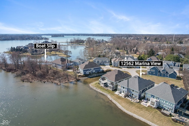 birds eye view of property featuring a residential view and a water view