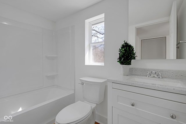 full bath with toilet, shower / washtub combination, and vanity