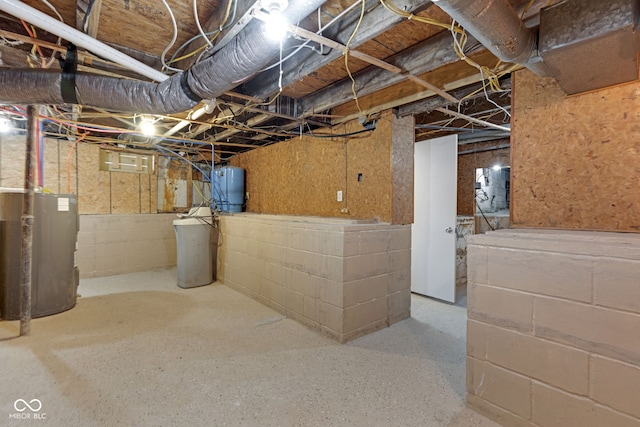 unfinished basement featuring water heater