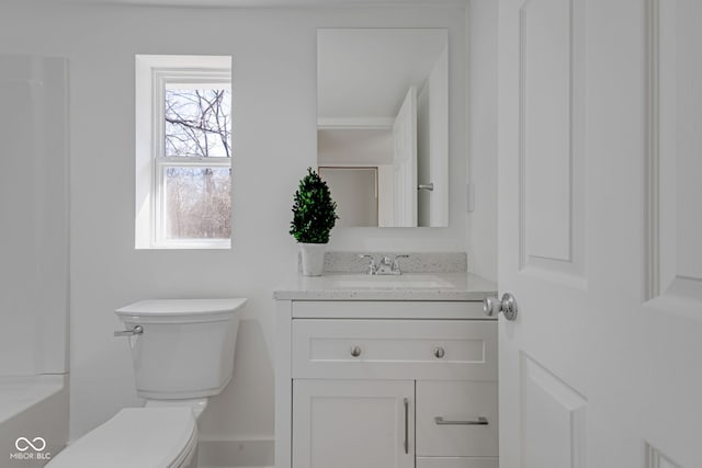 full bathroom with toilet and vanity