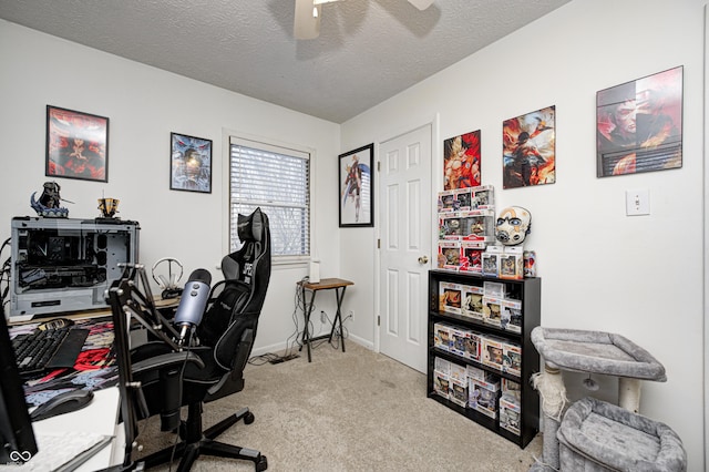 home office featuring baseboards, carpet, and a textured ceiling