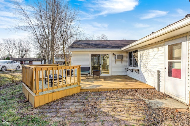 wooden terrace featuring fence