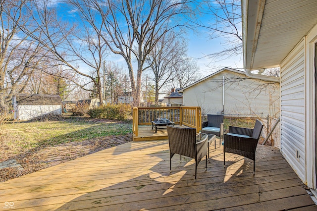 wooden deck featuring an outbuilding