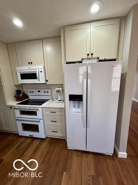 kitchen featuring white cabinetry, white appliances, light countertops, and dark wood-style flooring