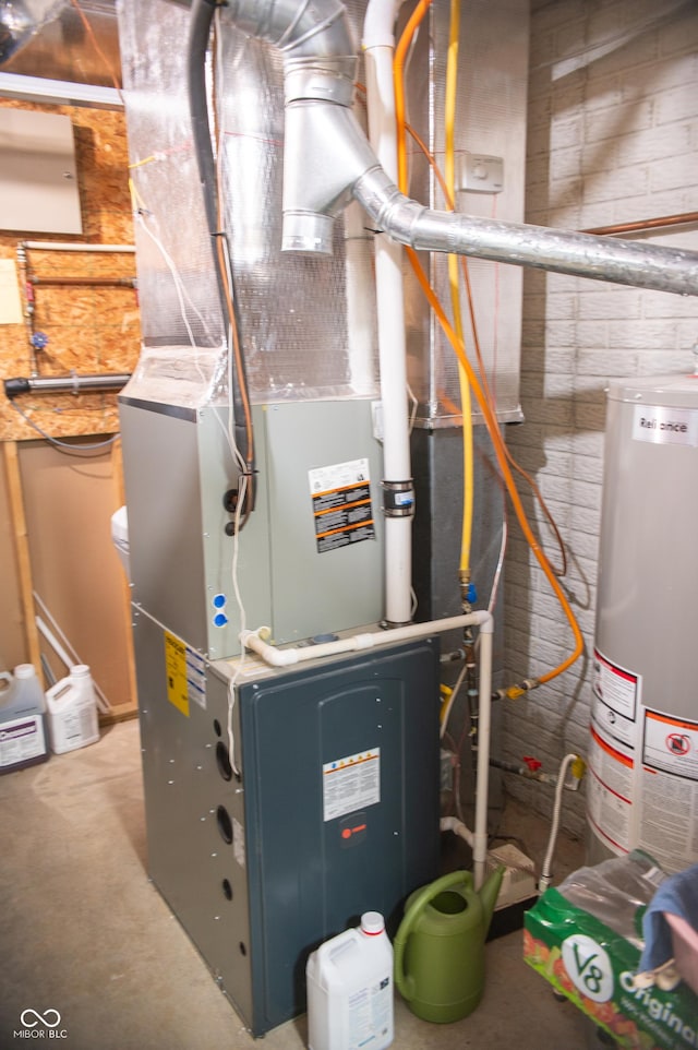 utility room featuring heating unit and water heater