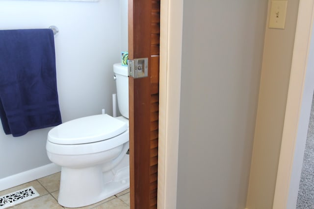 bathroom featuring tile patterned floors, visible vents, and toilet