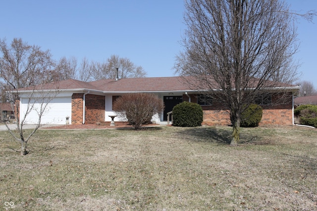 ranch-style house featuring a garage, brick siding, and a front lawn