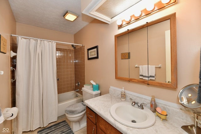 full bathroom featuring vanity, toilet, shower / bath combo with shower curtain, and a textured ceiling