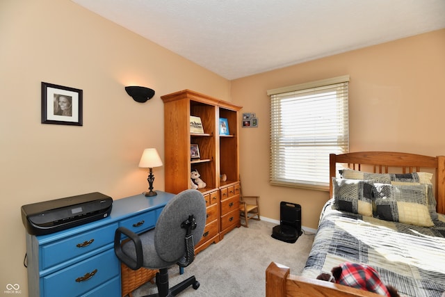 carpeted bedroom featuring baseboards