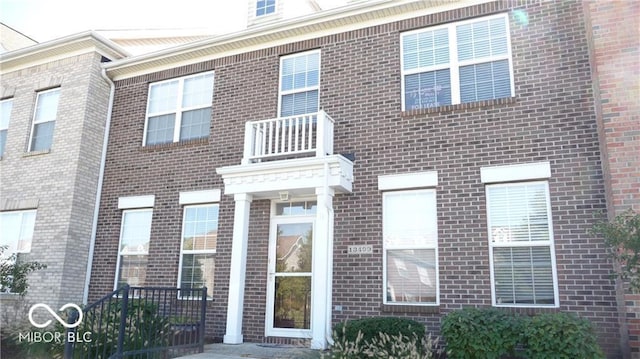 view of front of house with brick siding