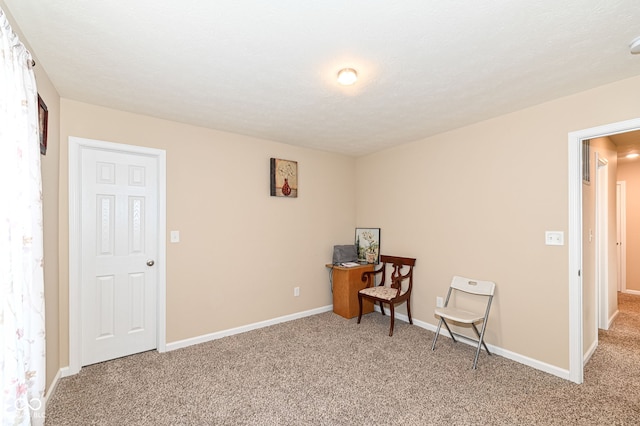 unfurnished room with baseboards and carpet floors