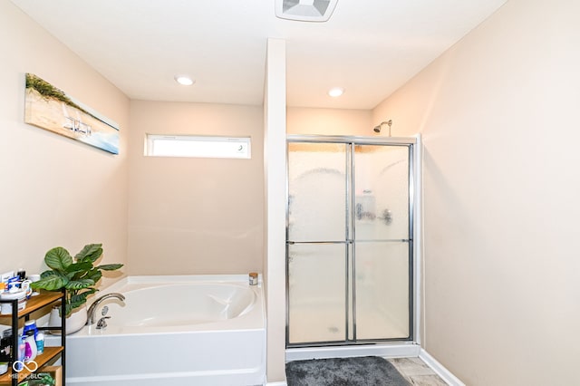 full bath with visible vents, a bath, baseboards, and a stall shower