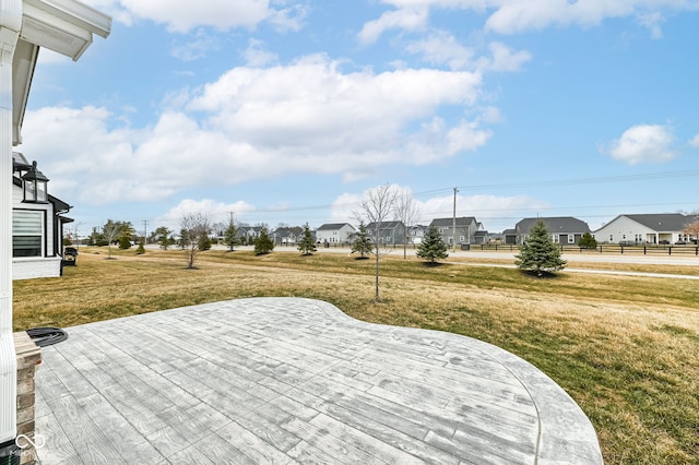 wooden deck featuring a lawn