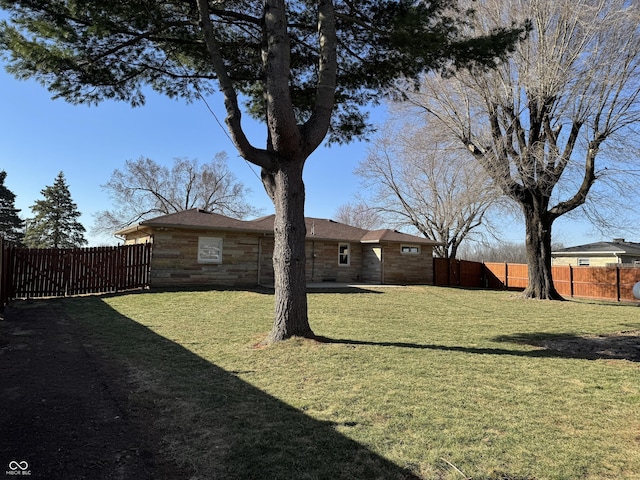 view of yard with a fenced backyard