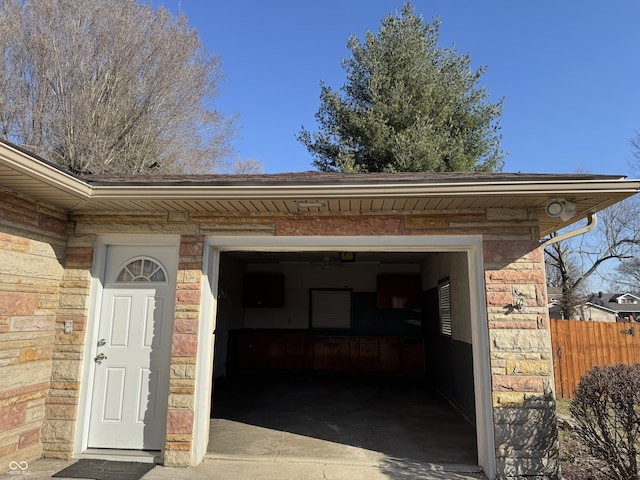 garage with fence