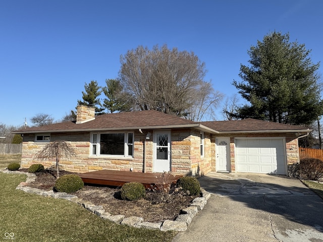 single story home with a garage, stone siding, a chimney, and driveway