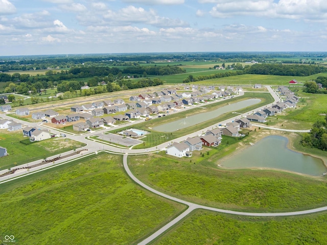 bird's eye view featuring a residential view and a water view