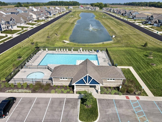 birds eye view of property featuring a residential view and a water view