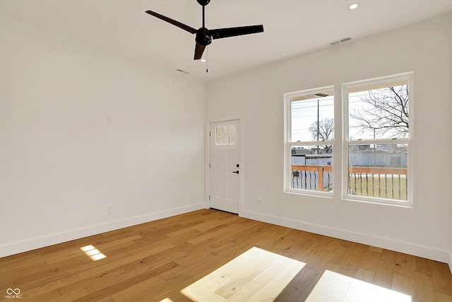 unfurnished room with visible vents, baseboards, recessed lighting, light wood-style floors, and a ceiling fan