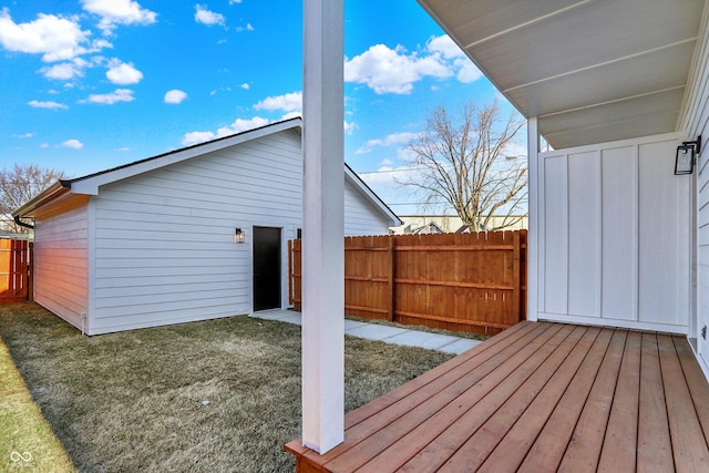 wooden terrace with fence and a lawn