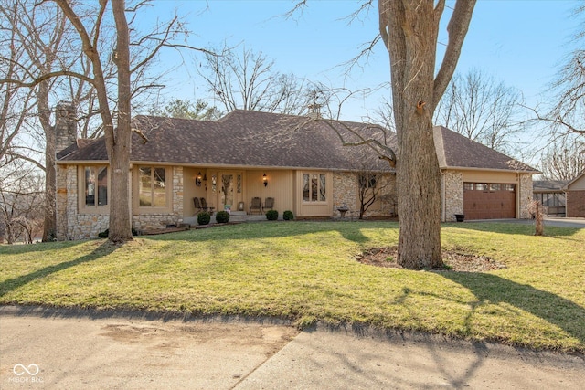 single story home with a front lawn, a chimney, a garage, stone siding, and driveway