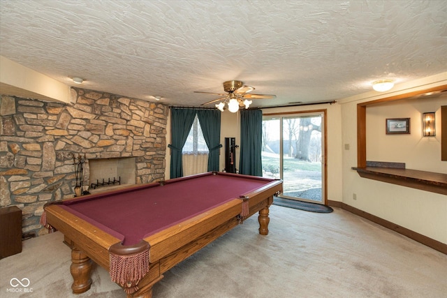 game room with pool table, a ceiling fan, carpet floors, and a textured ceiling