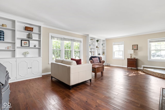 living area with plenty of natural light, dark wood-style floors, baseboards, and built in shelves