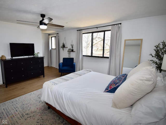 bedroom with wood finished floors and ceiling fan