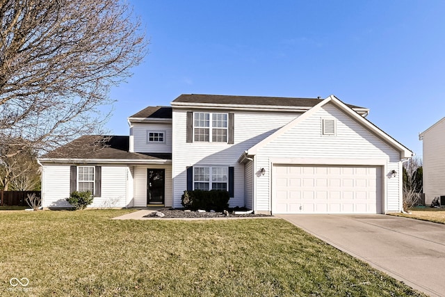 traditional home featuring an attached garage, concrete driveway, and a front yard