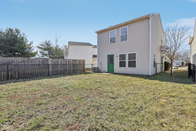 back of property featuring cooling unit, a lawn, and a fenced backyard