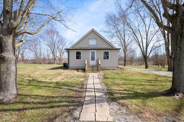 bungalow-style home with a front lawn