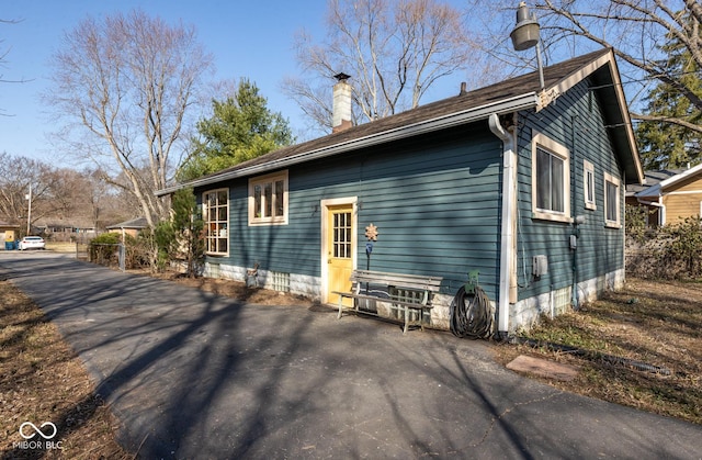 exterior space featuring a chimney