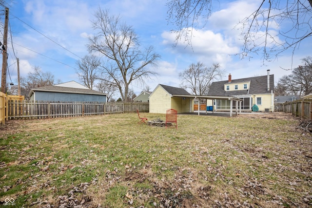 view of yard with a patio area and a fenced backyard