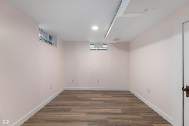 below grade area with wood finished floors and baseboards