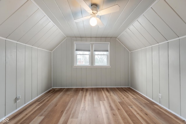 additional living space featuring a ceiling fan, vaulted ceiling, and wood finished floors