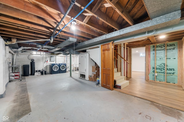 below grade area featuring stairway and independent washer and dryer