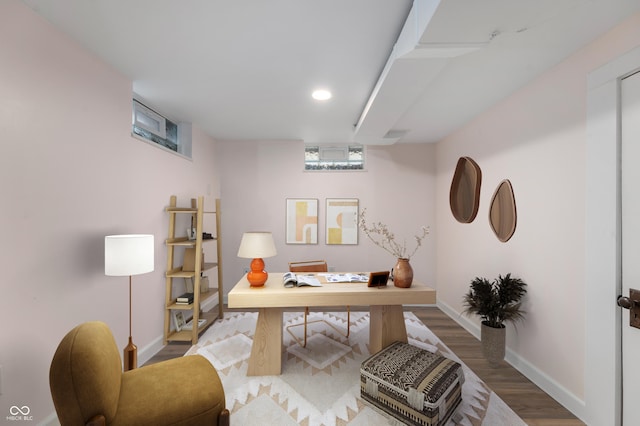 office area with wood finished floors and baseboards