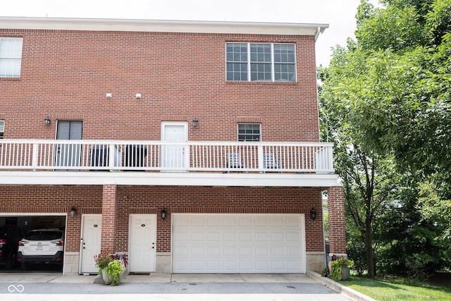 view of front facade with brick siding and driveway