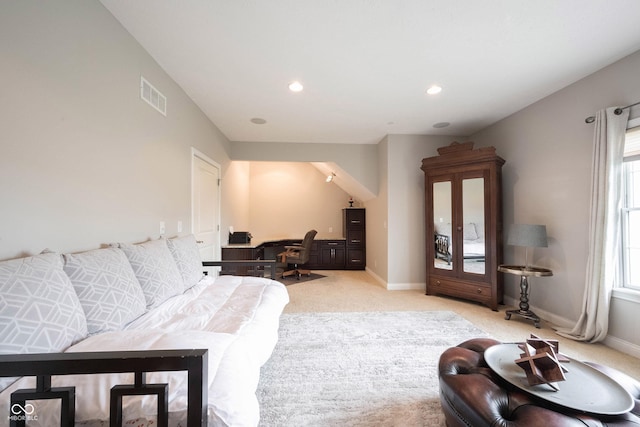 living room with recessed lighting, light colored carpet, visible vents, and baseboards