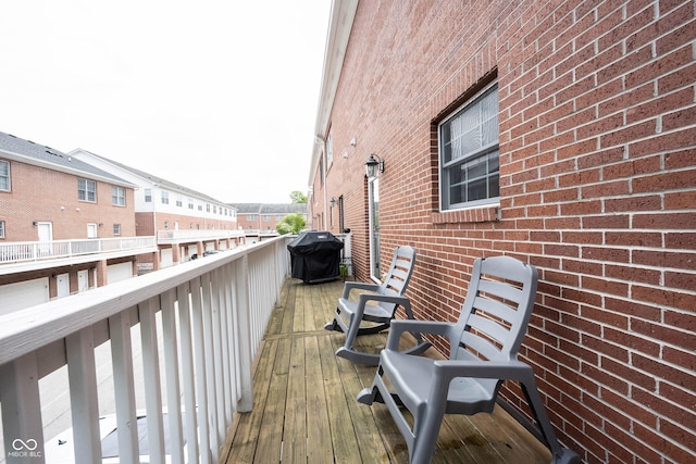 wooden terrace featuring area for grilling