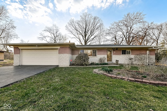 ranch-style house with brick siding, a front yard, an attached garage, and driveway