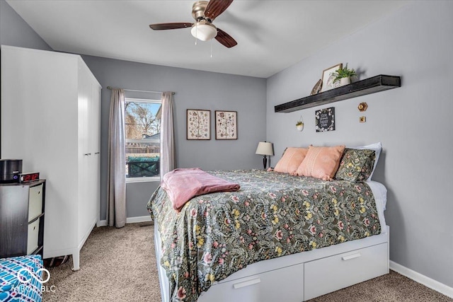 bedroom with a ceiling fan, baseboards, and carpet floors