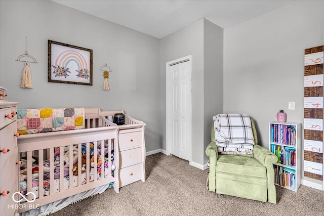 carpeted bedroom with baseboards and a closet