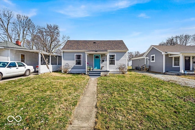 bungalow-style house featuring a front lawn