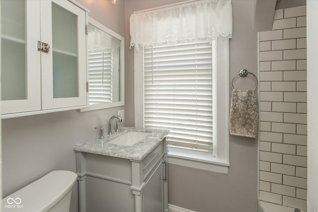 bathroom featuring toilet and vanity